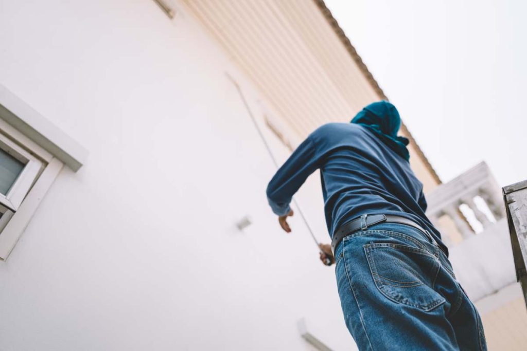 Man painting white wall house faded film look