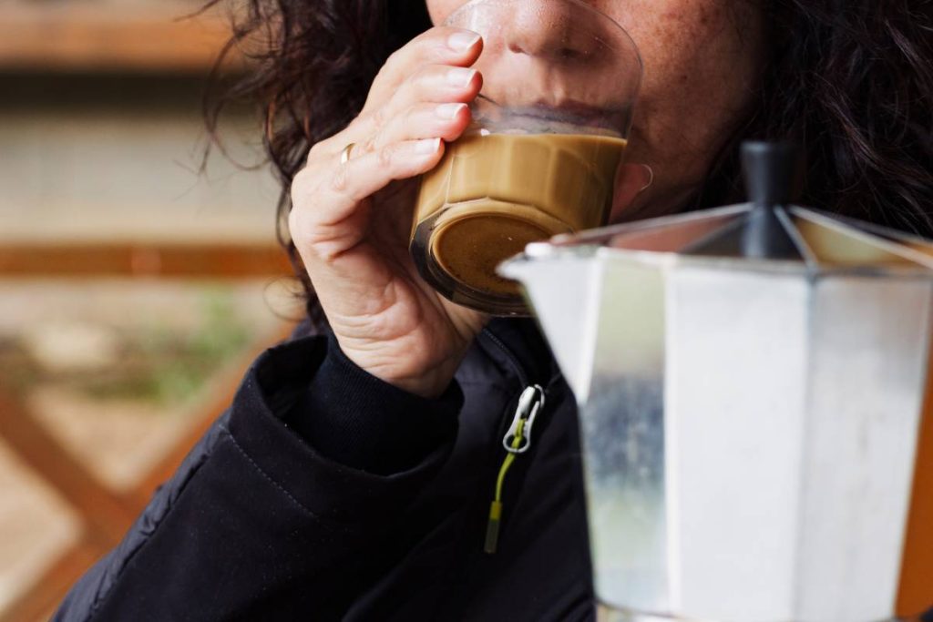 woman drinking coffee in a glass italian coffee m-2024-12-01-23-25-32-utc (1)